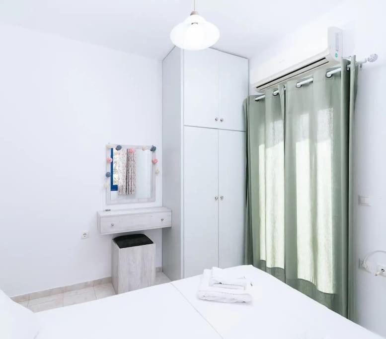 Postel nebo postele na pokoji v ubytování Zorbas Apartments-Am Strand von Lentas