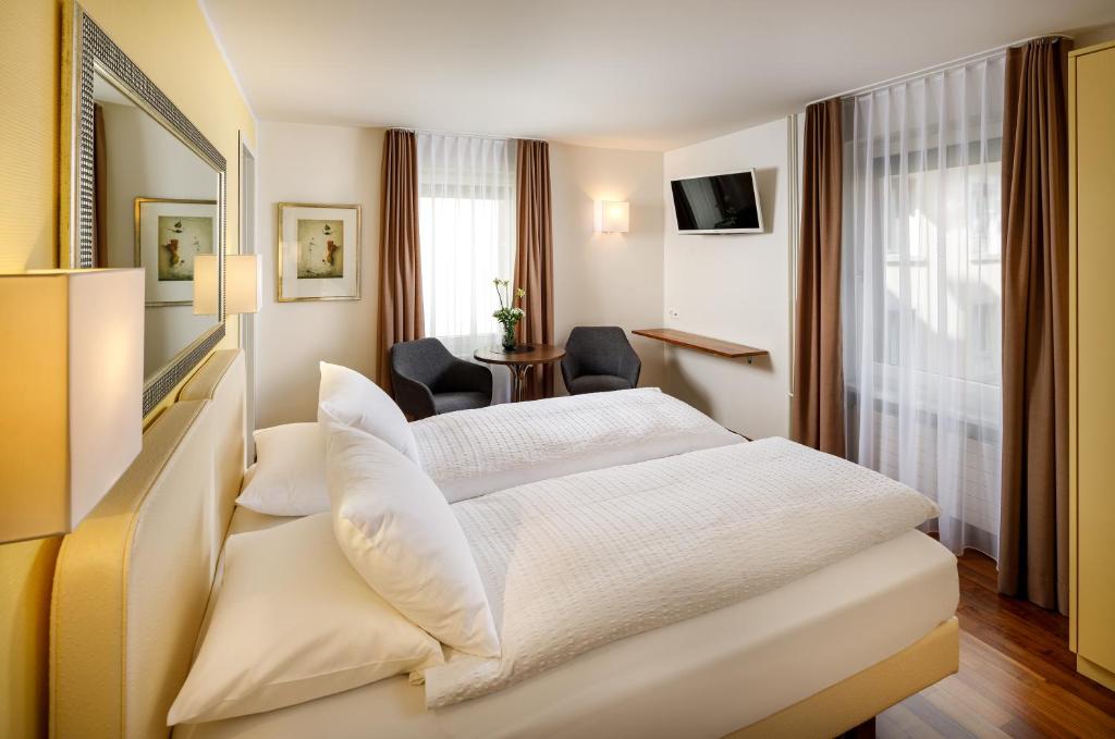 Postel nebo postele na pokoji v ubytování Aparthotel Familie Hugenschmidt
