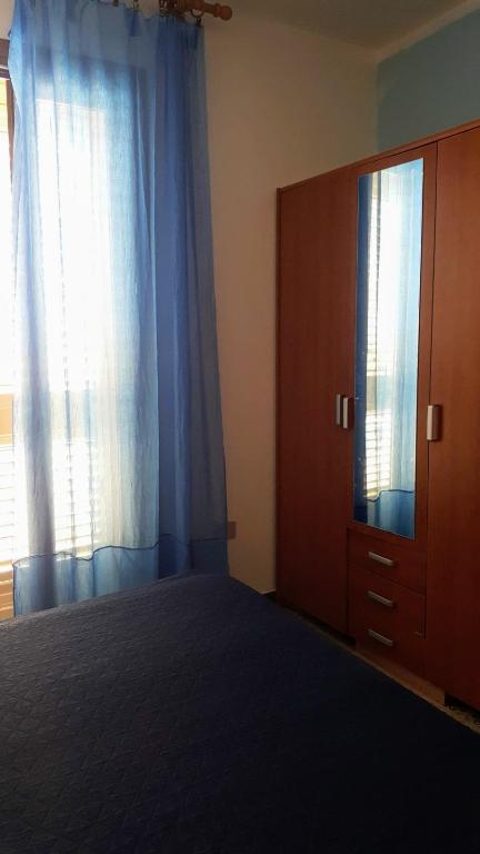 Postel nebo postele na pokoji v ubytování piccolo monolocale al porticciolo