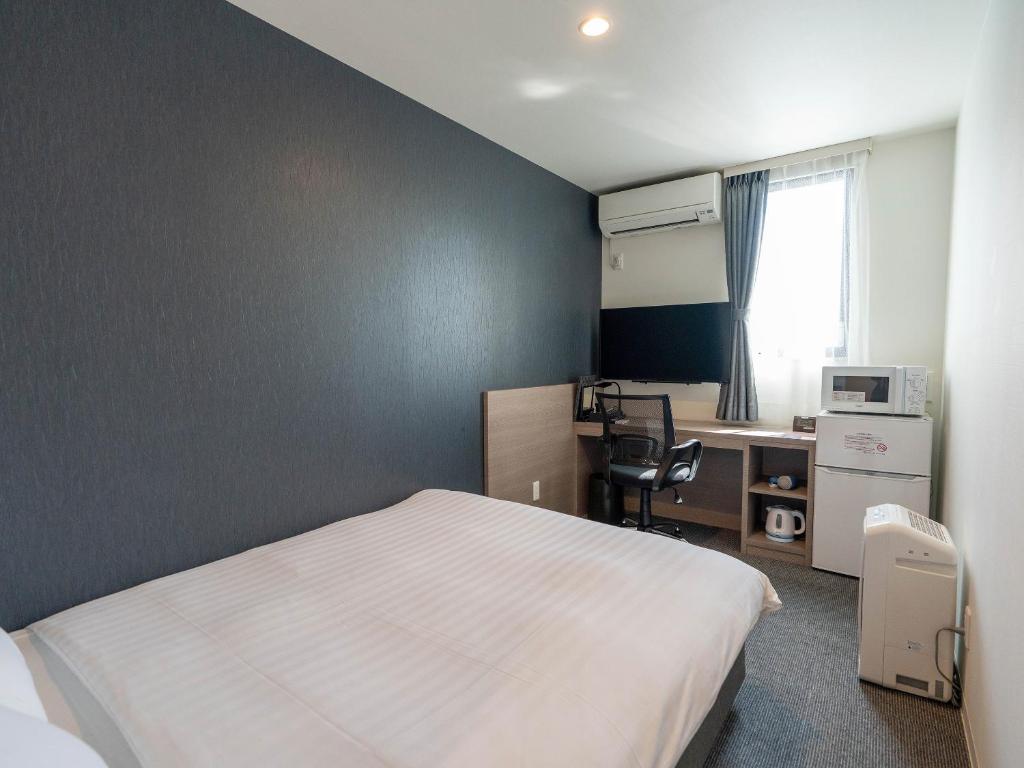 TV a/nebo společenská místnost v ubytování HOTEL R9 The Yard Ashikagaekinishi