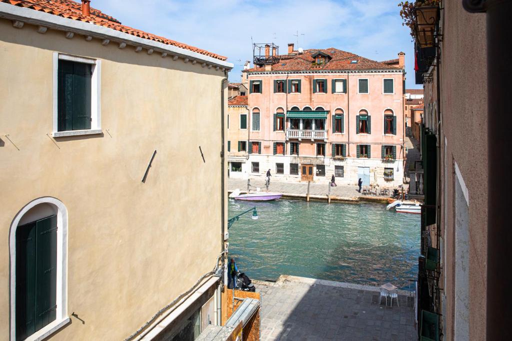 a view of a canal between two buildings at Palazzina Riello in Venice