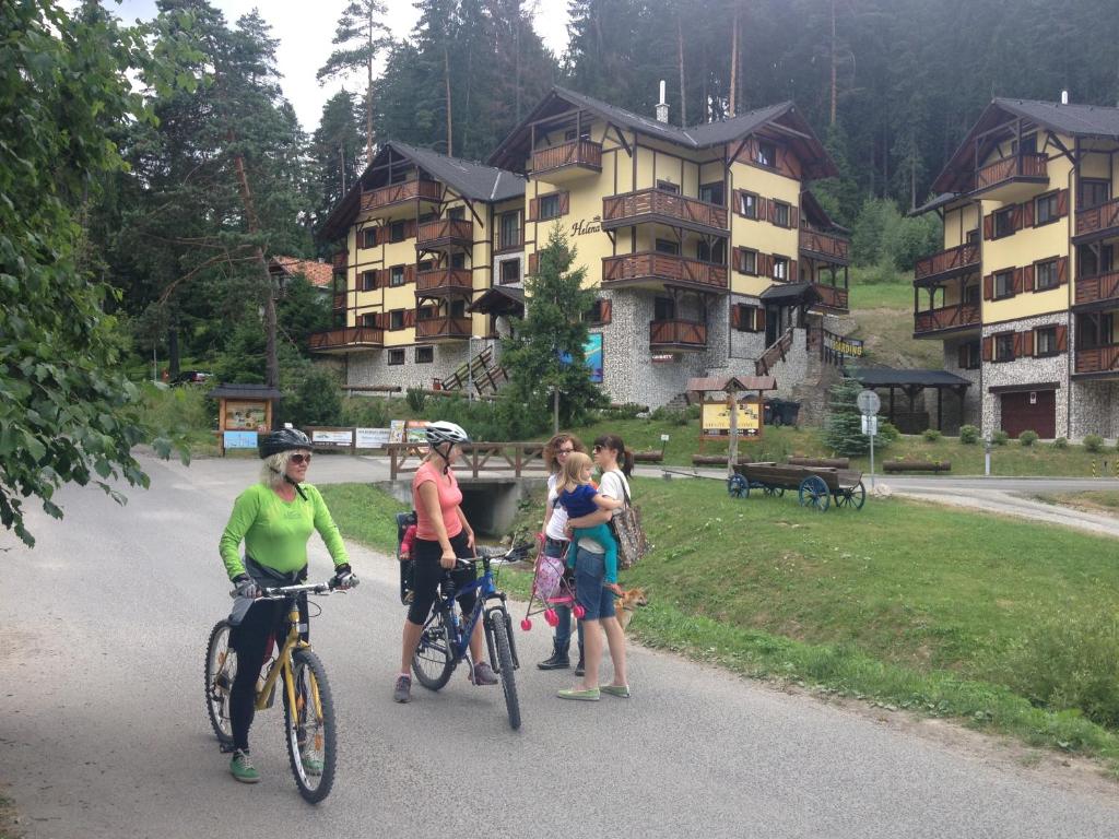 a group of people standing with bikes on a road at Vila Helena Hrabovo - Studio Helena 5 in Ružomberok