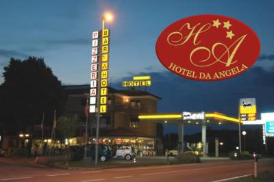 a gas station with a sign in front of it at Hotel Da Angela in Sedegliano