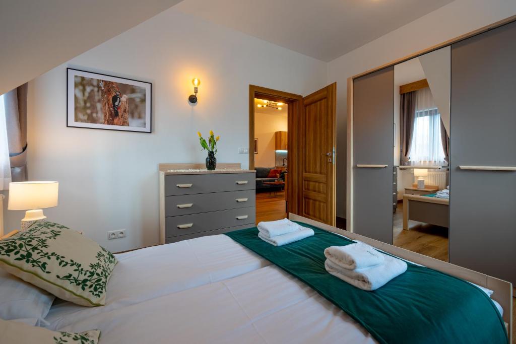 Postel nebo postele na pokoji v ubytování Apartamenty Otulina