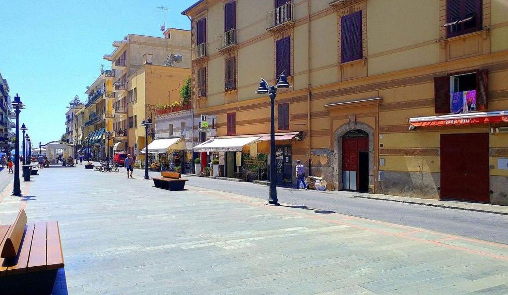 an empty street in a city with buildings at SOLEIL LUXURY APARTMENT in Maiori