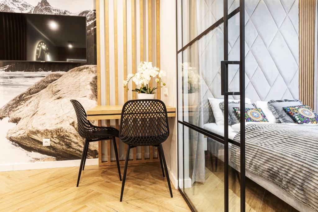 Televízia a/alebo spoločenská miestnosť v ubytovaní Apartment Antalovka Residence & Spa