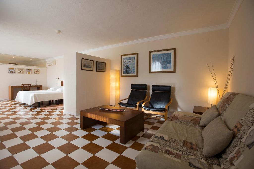 Postel nebo postele na pokoji v ubytování Hotel Cal Naudi