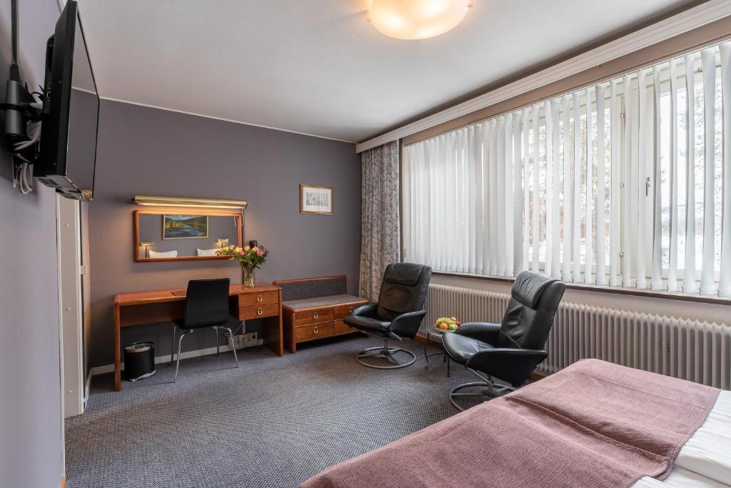 TV a/nebo společenská místnost v ubytování Hotell Villa Sparta