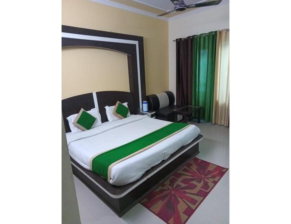 a bedroom with a large bed in a room at Hotel KS International, Katra in Katra