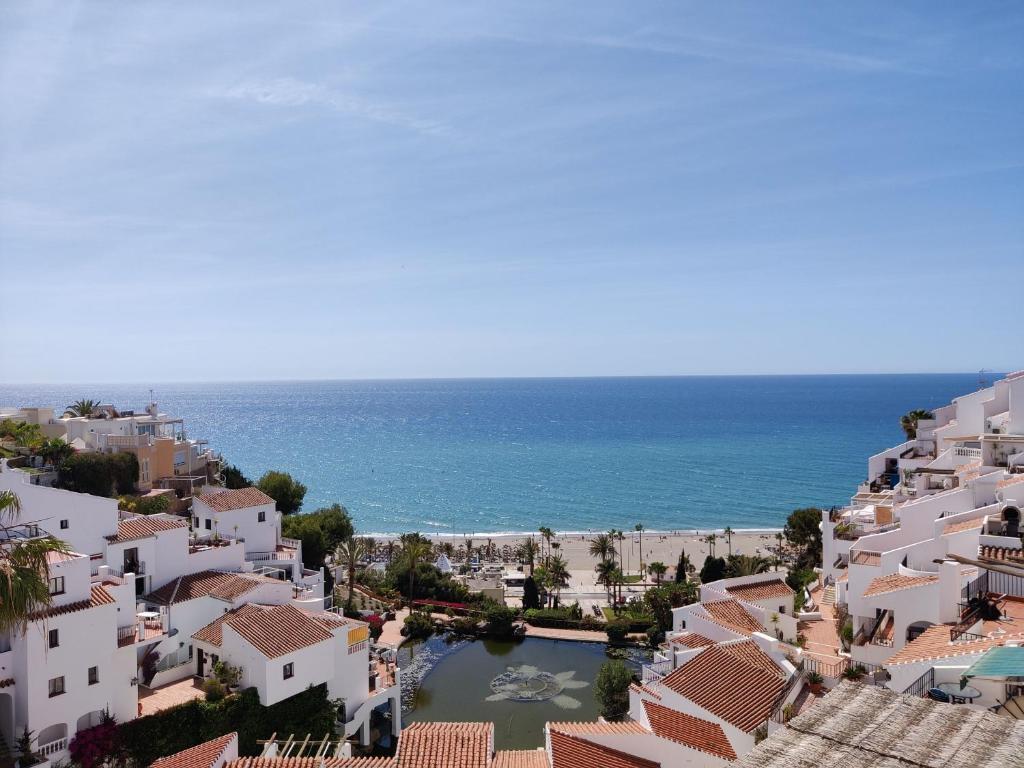 a view of the beach from the town at R1371 Capistrano Playa 417 in Nerja