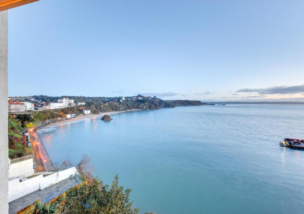 a view of a body of water with a beach at Waldo Hafod y Mor in Tenby