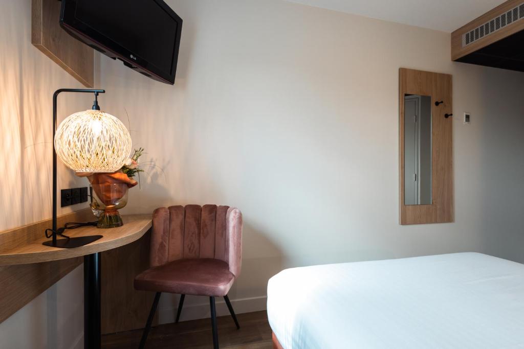 Postel nebo postele na pokoji v ubytování KYRIAD DIRECT ORLEANS NORD - Cap Saran