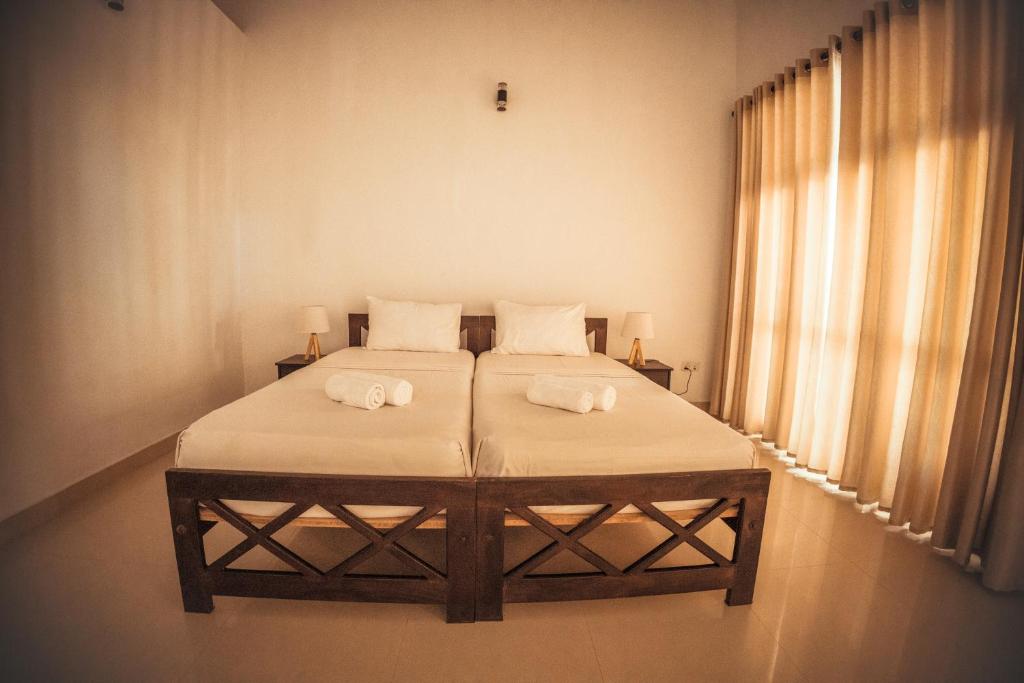 Postel nebo postele na pokoji v ubytování Lankahuts Villa
