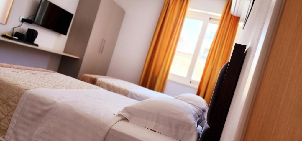 Postel nebo postele na pokoji v ubytování 3B Suites Boutique Hotel