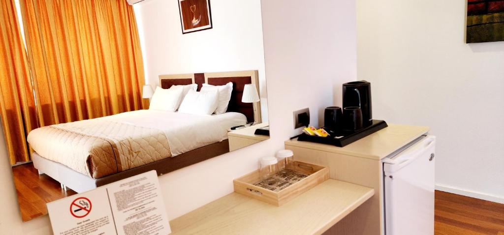 Postel nebo postele na pokoji v ubytování 3B Suites Boutique Hotel