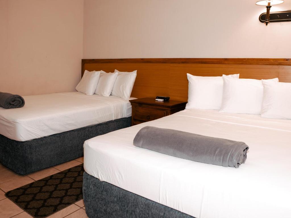 Postel nebo postele na pokoji v ubytování Kiskadee Korner Vacations