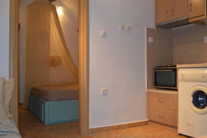 Kuchyň nebo kuchyňský kout v ubytování Tholari project by S.