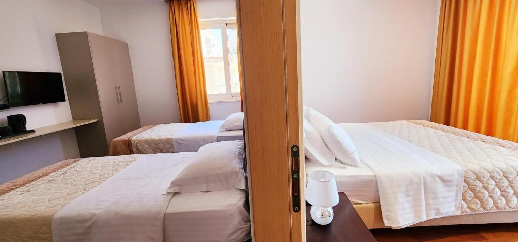 Postel nebo postele na pokoji v ubytování 3B Suites Boutique Hotel