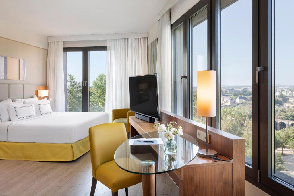Postel nebo postele na pokoji v ubytování Melia Luxembourg