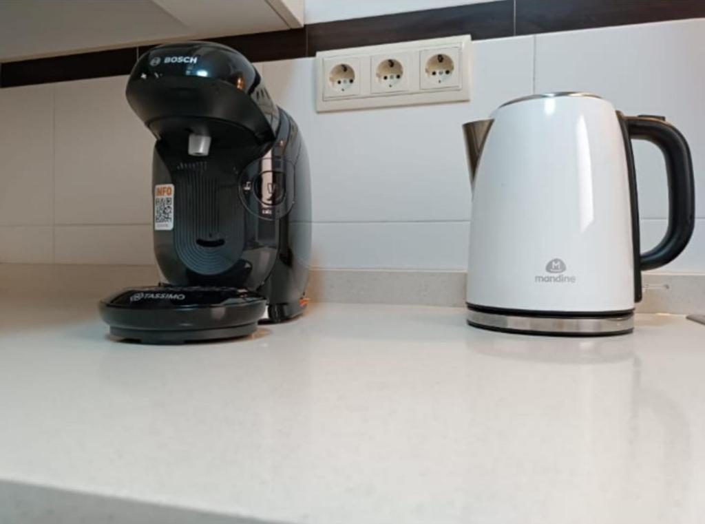 a coffee maker sitting on a counter next to a coffee pot at Mar Menor in San Pedro del Pinatar