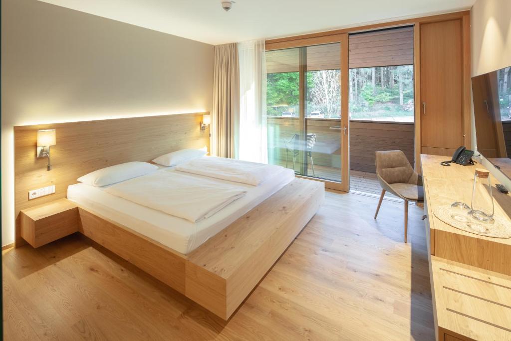Postel nebo postele na pokoji v ubytování Hotel Munde