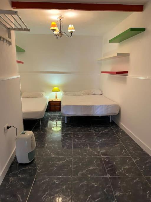 Posteľ alebo postele v izbe v ubytovaní CLAUDIA Puertito de Adeje - 2 bedrooms, 70mq, on the beach