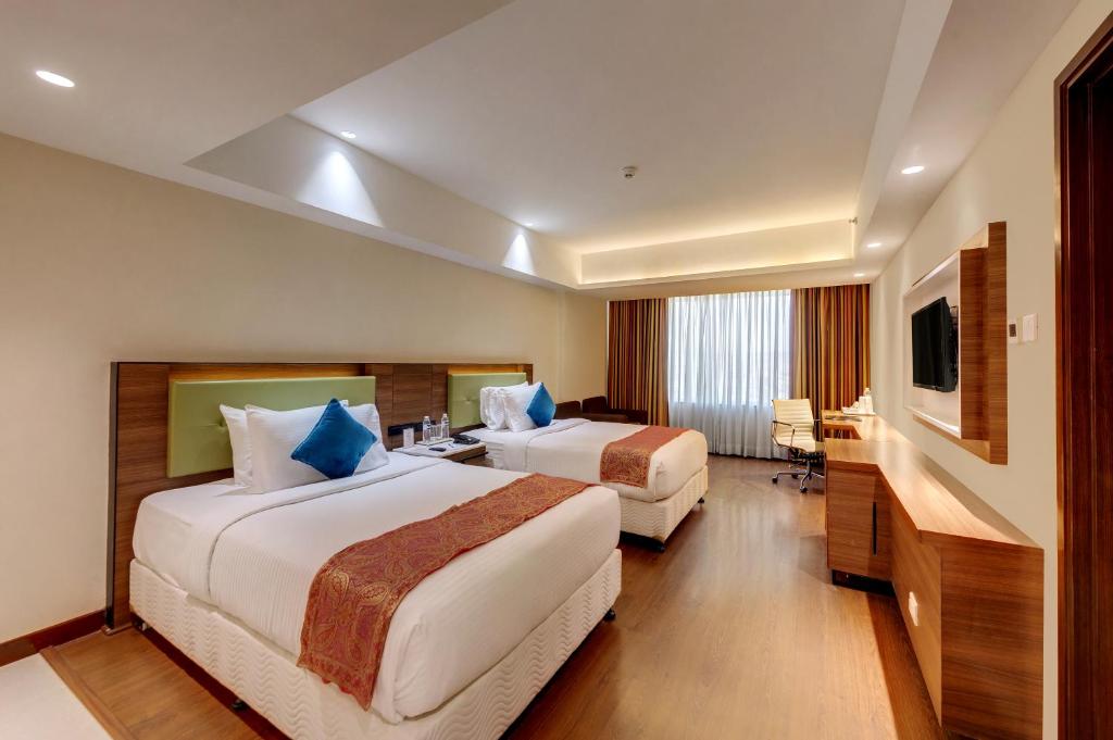 Postel nebo postele na pokoji v ubytování Amarpreet, Chhatrapati Sambhajinagar - AM Hotel Kollection
