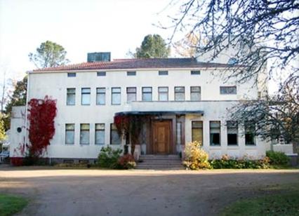 a large white building with a front door at Villa Helleranta in Ulvila