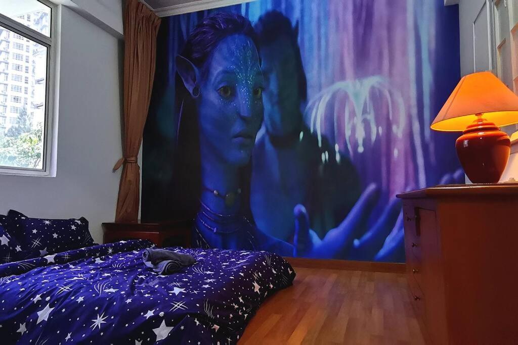 a bedroom with a bed with a painting on the wall at KLCC/Pavilion Avatar Theme 5BR in Kuala Lumpur