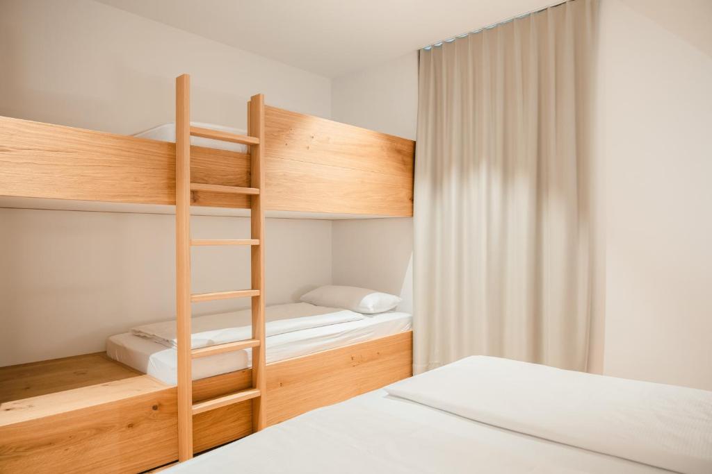 Postel nebo postele na pokoji v ubytování Hotel Munde