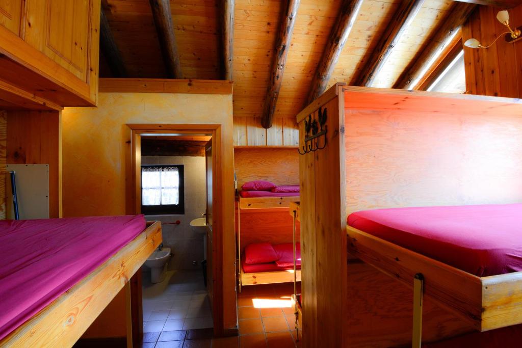 Posteľ alebo postele v izbe v ubytovaní Rifugio Vieux Crest
