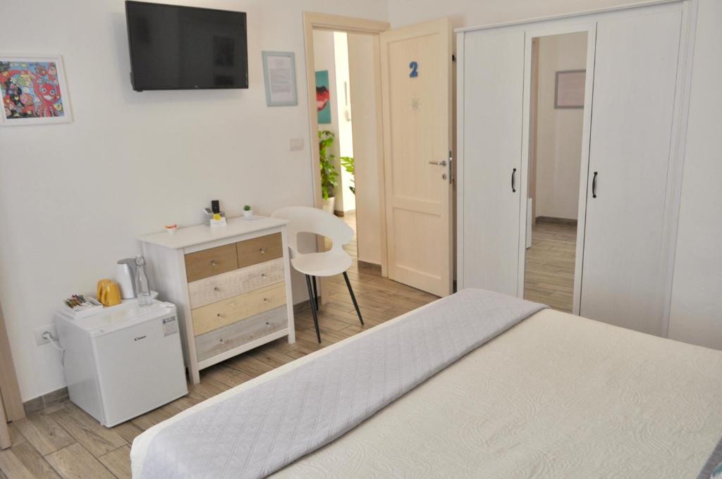 Posteľ alebo postele v izbe v ubytovaní B&B Rosa dei Venti