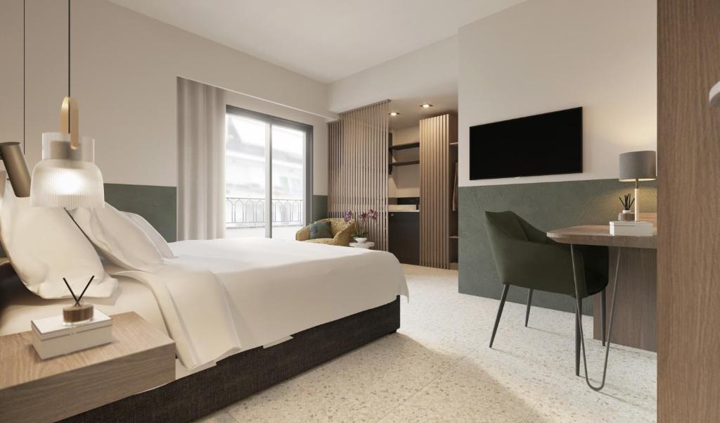 een slaapkamer met een bed, een bureau en een televisie bij Evripidou 7 - Kalamata Mediterranean Suites in Kalamata