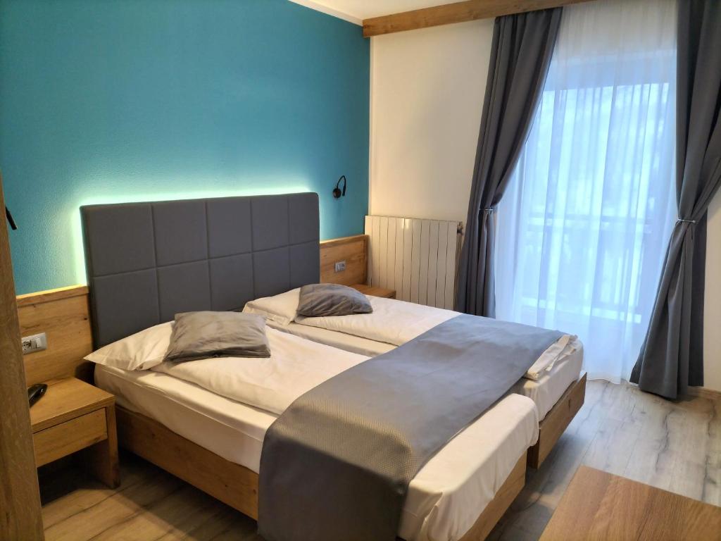 Postel nebo postele na pokoji v ubytování Hotel Angelo