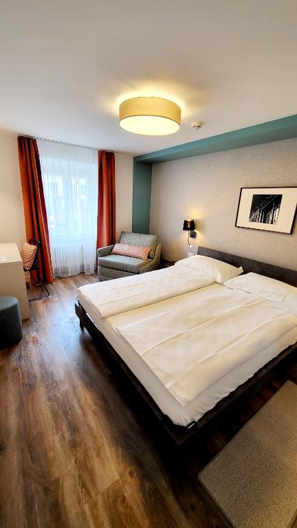 Voodi või voodid majutusasutuse Hotel Pestalozzi Lugano toas