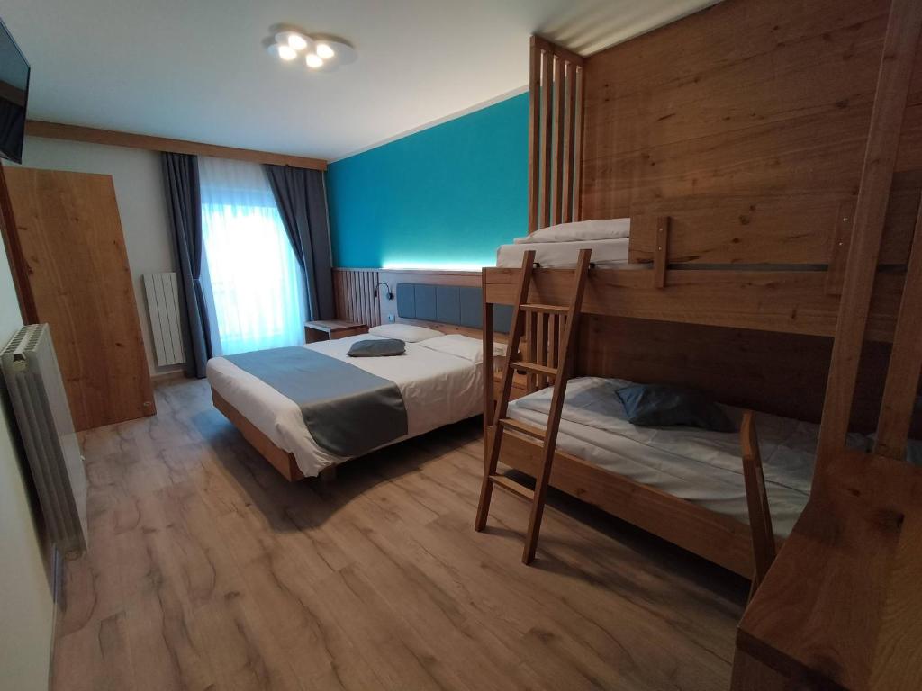Postel nebo postele na pokoji v ubytování Hotel Angelo