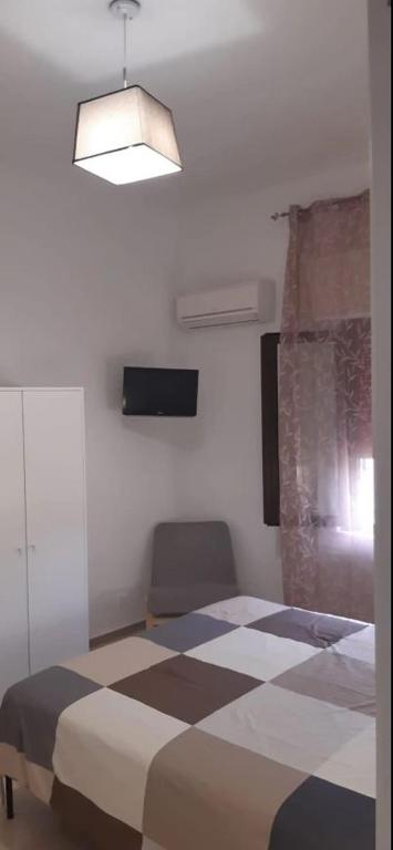 Postel nebo postele na pokoji v ubytování Casa Poseidonia - intero alloggio in riva al mare