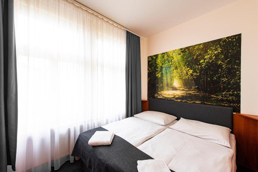 Postel nebo postele na pokoji v ubytování Hotel Zlatá Váha