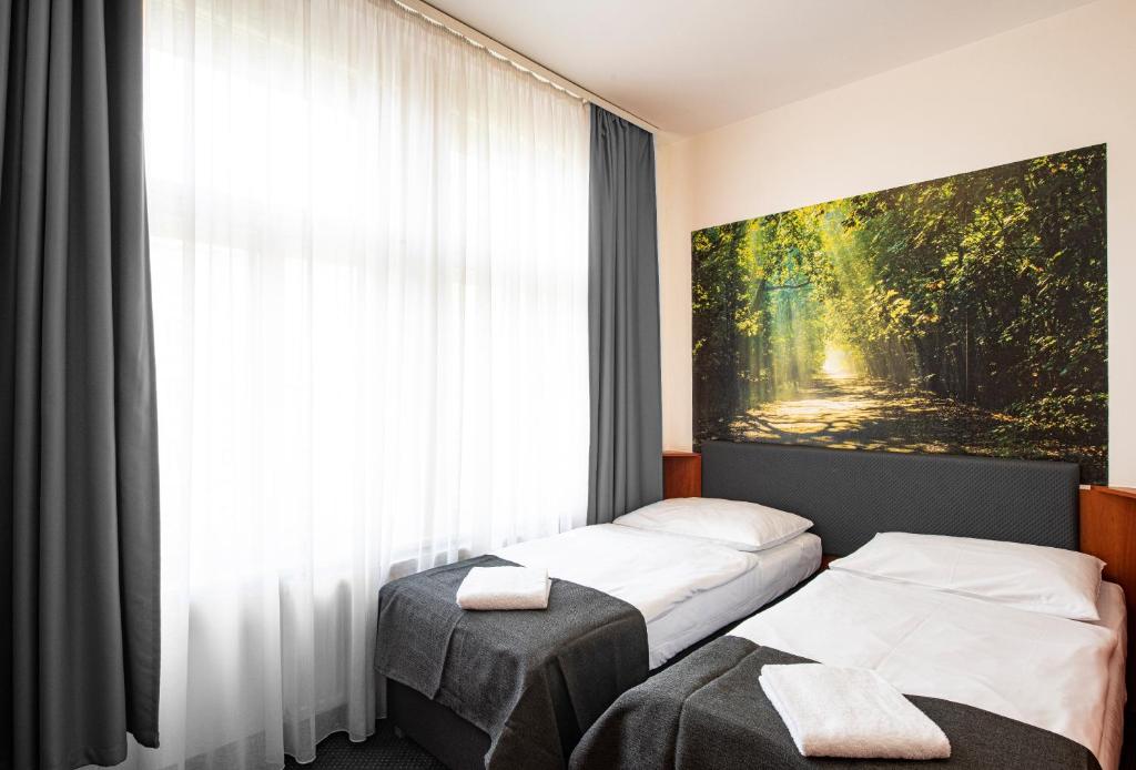 Postel nebo postele na pokoji v ubytování Hotel Zlatá Váha