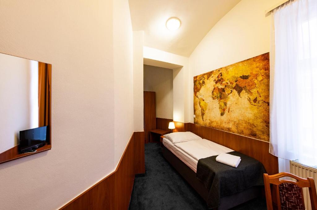 Postel nebo postele na pokoji v ubytování Hotel Zlatá Váha