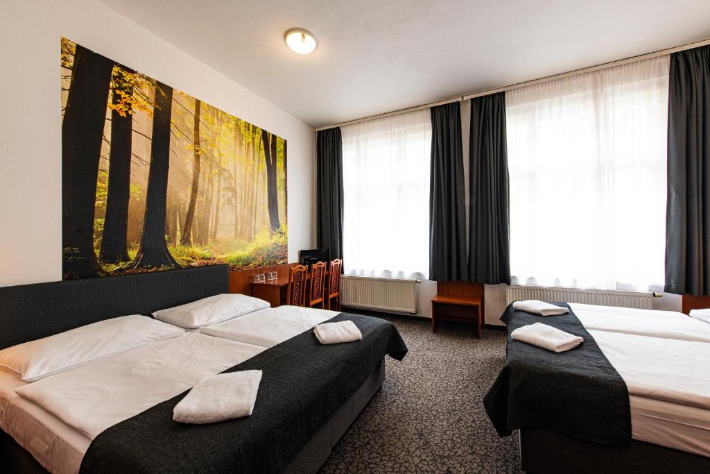 Postel nebo postele na pokoji v ubytování Hotel Zlatá Váha