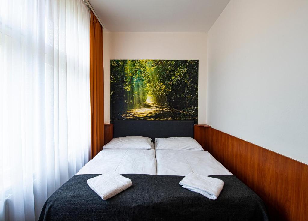 Postel nebo postele na pokoji v ubytování Hotel Zlatá Váha