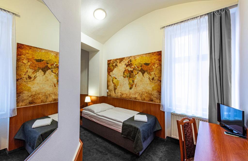 Postel nebo postele na pokoji v ubytování Hotel Zlatá Váha