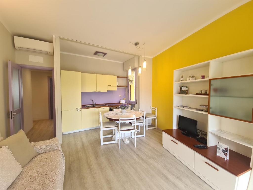 a living room and kitchen with a table and a couch at Sara by PortofinoVacanze in Rapallo