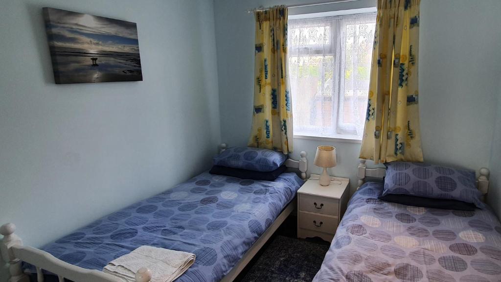 Postel nebo postele na pokoji v ubytování Yr Hafdy