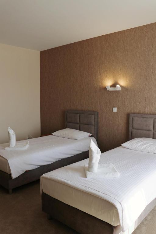 Postel nebo postele na pokoji v ubytování M&W Hotel Wronowski