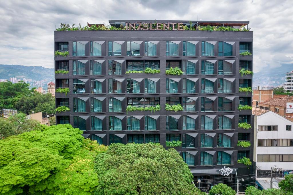 a building with plants on the top of it at Hashtag 98 Hotel By Jalo in Medellín