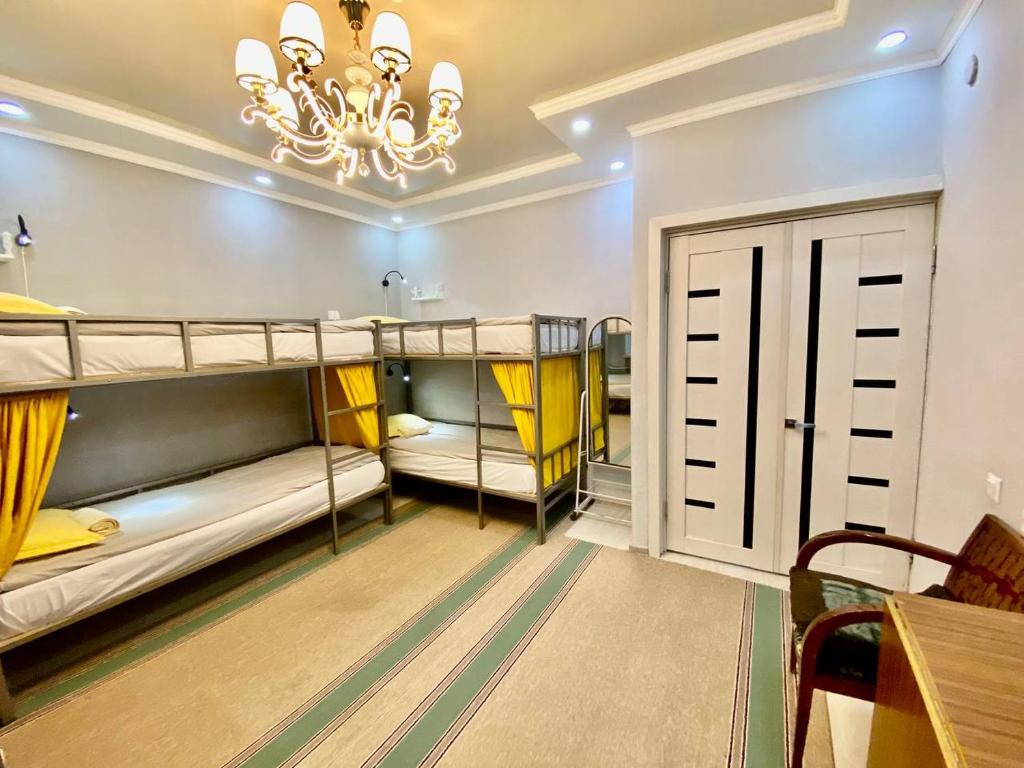 Postel nebo postele na pokoji v ubytování Downtown Homestay