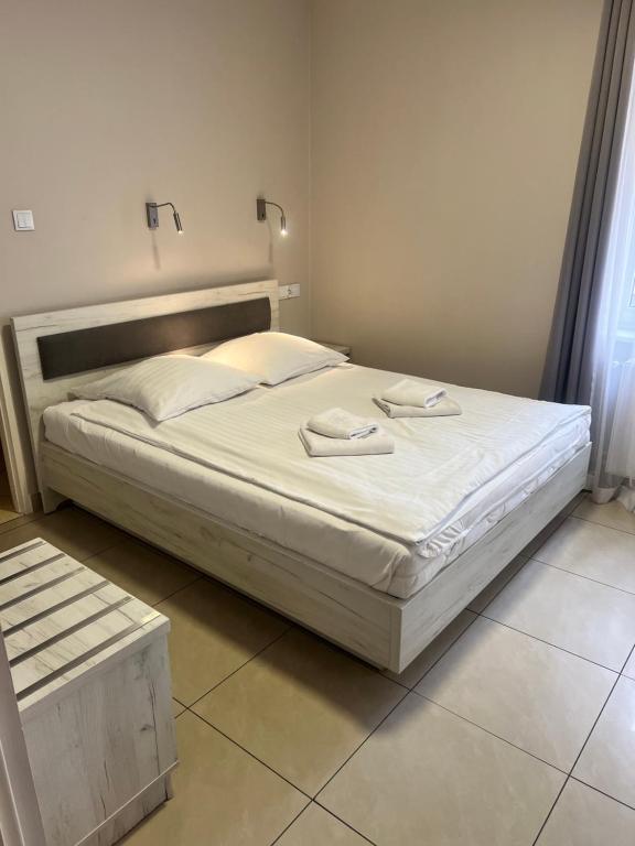Posteľ alebo postele v izbe v ubytovaní Rodos