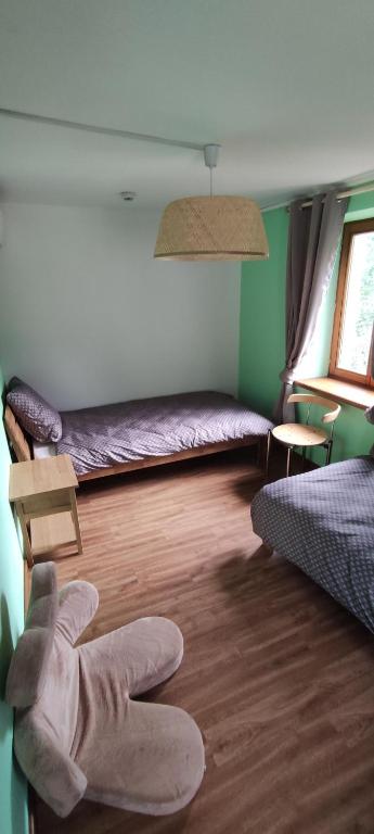 Postel nebo postele na pokoji v ubytování Les gîtes d'Argentin